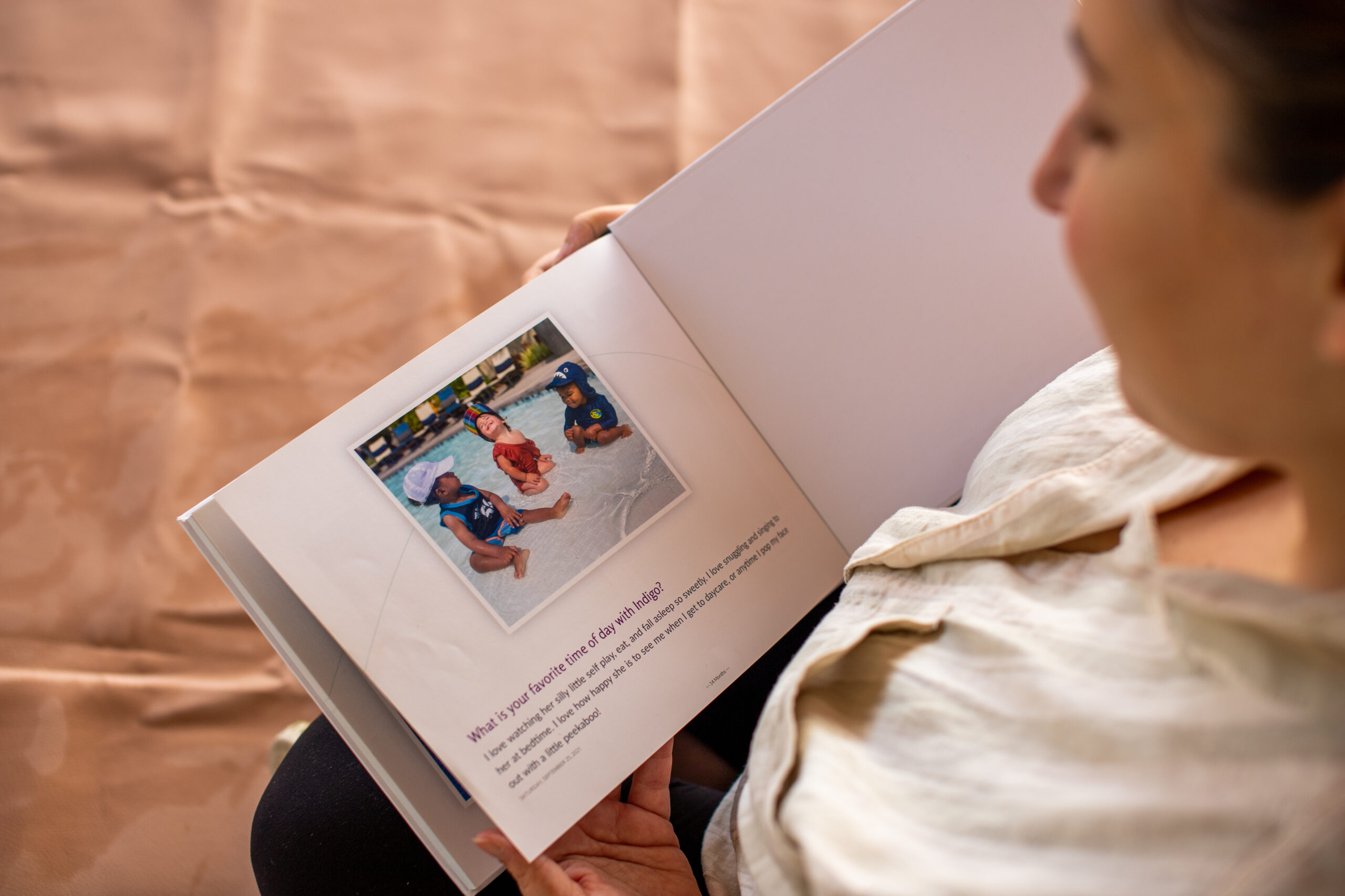 Mom reminiscing in a Qeepsake Book